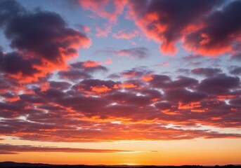 A peaceful evening sky with scattered cumulus clouds glowing in warm orange, pink, and light blue hues. The sun sets below the horizon, casting soft light rays upward. Captured in full HD from a groun