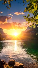 A breathtaking landscape with a vibrant sunset over a tranquil lake surrounded by mountains and lush foliage. Captured during golden hour