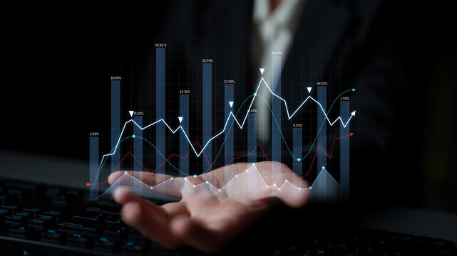 A businessman presenting graphical data on a digital interface, showcasing analysis and trends for effective financial predictions and business insights. Scalp