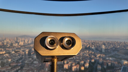 Viewfinder overlooking city skyline at sunset