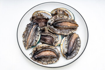 Fresh abalone ingredients on a pure white background