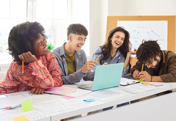 Fototapeta premium Office team of business professional people collaborates and working together on financial documents during a meeting. Teamwork, cooperation, and the collective effort in a business environment.