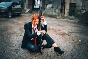 Redhead woman in a suit with a rifle. Special agent.
