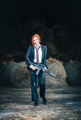 Redhead woman in a suit with a rifle. Special agent.