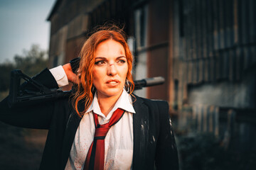 Redhead woman in a suit with a rifle