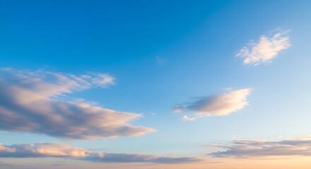 Obraz premium Blue sky with soft clouds a serene and peaceful background perfect for design elements and presentat