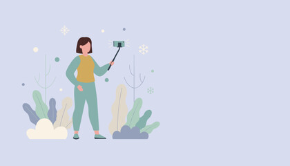 Woman taking a selfie with a stick in a stylized winter scene for social media and vlogging