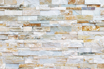 High-resolution close-up of an intricately arranged stone wall, revealing a harmonious blend of textures and natural patterns. Seamless design perfect for architectural backgrounds, material mapping.