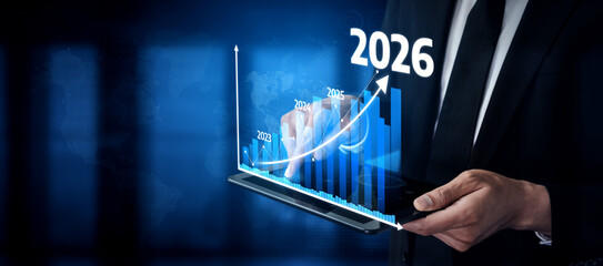 A businessman interacts with a digital screen displaying growth projections and trends leading to 2026, emphasizing analytics and future strategies in a vibrant blue design. Tessel