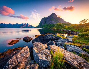 Scenic landscape featuring mountains, water, rocks, and sky at sunset