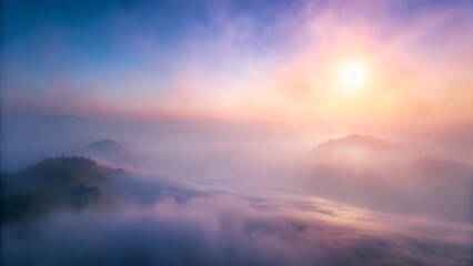 Sunrise over mountains with sun rays and clouds in a colorful sky