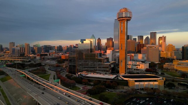 Aerial view of Dallas downtown and famous Reunion tower landmark under evening sun light.