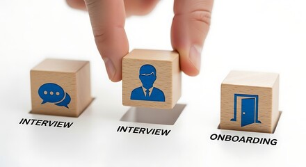 Hand places wooden block with person icon into the 'interview' slot, representing the hiring process and onboarding, conveying a sense of order and professionalism.