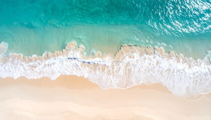 Aerial view of a pristine beach with turquoise waves breaking on the shore