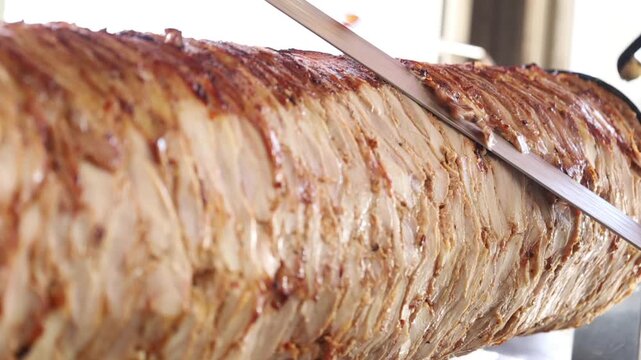  Roasting meat for shawarma on a vertical grill