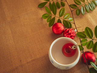 Christmas balls on calico for a warm copy space in winter and New Year.