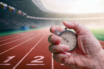 Handheld Stopwatch Over the Running Track Finish Line Highlighting Speed, Timing, and Performance