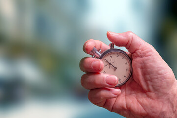 Close-Up Hand Holding Stopwatch For Timing, Precision, And Speed In Sports Or Work