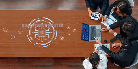 A diverse group of professionals collaborates in a modern office setting, analyzing data on laptops and tablets while discussing strategies through visual presentations. Trope