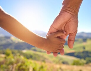Close-Up of a Child's Hand Holding an Adult's Hand Against a Natural Landscape Backdrop