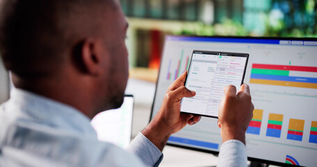 African American Payroll Manager Manages Billing