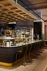 Modern bar with stylish seating and elegant decor in a lively setting