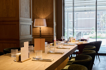Elegant dining setup in a modern restaurant with natural light