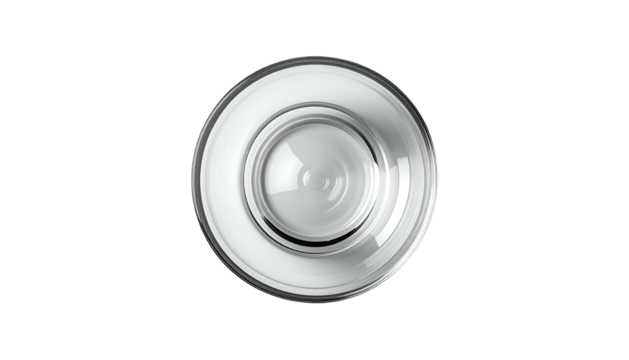 Top-down view of a clear, round glass with concentric ridges