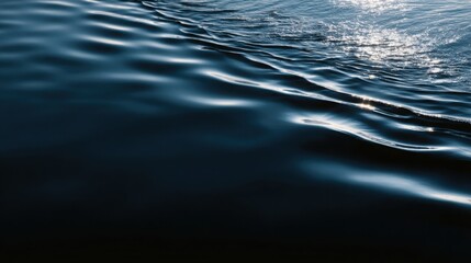 dark navy water with delicate ripples and reflected light, tranquil luxury aesthetic background