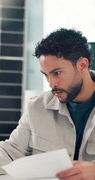 Business, man or paperwork with planning in office for PV market analysis, feasibility study or report. Renewable power, solar project developer and documents with research for environmental permits