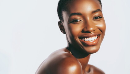 Close up of a smiling African woman's face with smooth glowing skin Happy