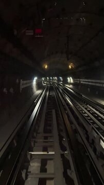 Paris, France. Timelapse of the subway inside the tunnel. The train moves towards to the next station