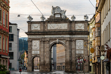 Historic European Triumphal Arch with Sculptures and Classical Architecture in City Street – Cultural Landmark and Travel Destination