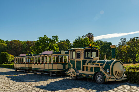 Tourist Train Parked in Sunny Park Transportation Travel Vehicle Outdoor Leisure Sightseeing