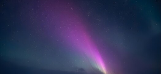 Vibrant aurora borealis lights up starry night sky