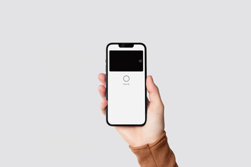 Hand holding smartphone for contactless mobile payment