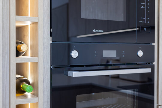 Modern built-in Johnson oven and microwave with wine storage
