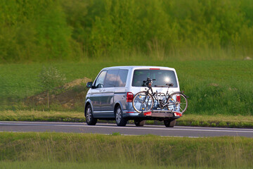 Bicycles secured on rear carrier during family vacation