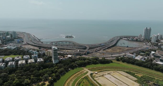 Morning view of the Mumbai Coastal Road in Maharashtra, India, famously known as the 'City of Dreams.' The scene captures a multileveled interchange roadway. A complex road network and urban design.