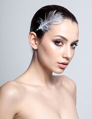 Fototapeta premium Stunning portrait of a woman with dark hair and a feather