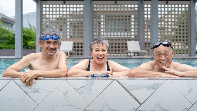 senior asian people enjoy summer vacation happy retirement, active adult exercising physical therapy at sport club swimming pool, elderly man travel with friends wellness life healthy lifestyle