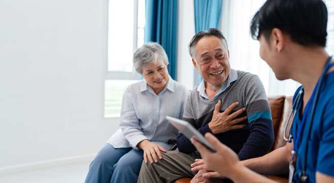 asian senior couple consult and discuss medical examination results with physiotherapist at clinic. home caregiver nurse visit retirement patient for health check up recovery process medical service	