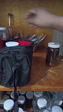 opening a jar of honey to sweeten coffee