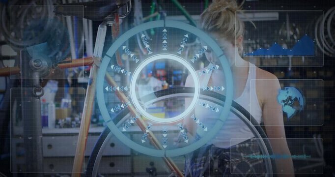 Female bike mechanic gripping and rotating wheel in shop as overlay scanning spokes for alignment