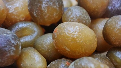 Dried tangerine peel, dried mandarin oranges or citrus, preserved fruit, Chen pi in Chinese, close up, macro, cover full screen
