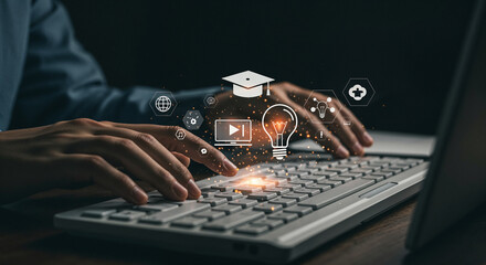 Person typing on keyboard with digital education icons floating above learning online