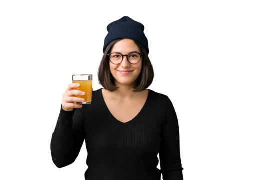 Smiling Woman with Orange Juice in Hand Isolated Portrait of a Young Attractive Woman Holding Glass of Juice Wearing Glasses and Beanie Isolated on Transparent Background