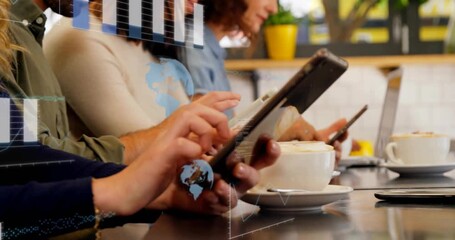 Colleagues tapping devices at cafe counter, starting bar chart and globe overlays showing tech data - Powered by Adobe