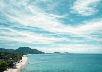 Tropical island paradise with turquoise ocean and lush green hills