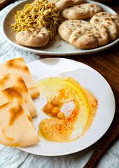 Delicious indian naan bread served with curried lentils and ghee